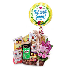 Get well soon flower delivery basket with pink flowers, healthy snacks, and a cheerful balloon
