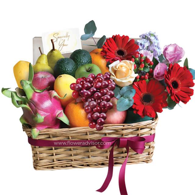 Fruit and flower hamper with fresh flowers and assorted fruits for flower delivery