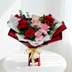 Red and pink rose bouquet with greenery for same-day flower delivery in Singapore