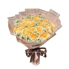 Elegant yellow rose bouquet with baby's breath, wrapped for flower delivery in Singapore