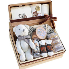 Baby gift set with teddy bear, clothes, baby bottles, and socks, ideal for flower delivery gifts.