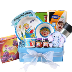 Blue baby gift hamper with diapers, plates, plush toy, prune extract and congratulations sign, ideal for flower delivery add-on.