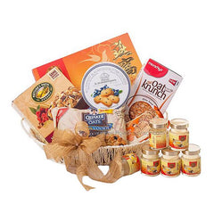 Gift hamper with cookies, cereal, oat biscuits and health drinks for flower delivery gifting