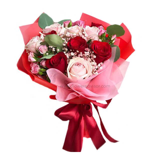Elegant red and pink rose bouquet with greenery, perfect for flower delivery in Singapore