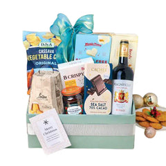 Festive gift hamper with snacks, chocolates, wine and greeting card, ideal for flower delivery gifts