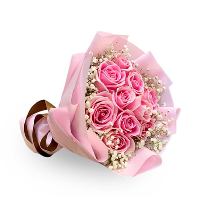 Pink rose bouquet with baby's breath, wrapped in pink paper for same-day flower delivery
