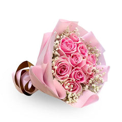 Pink rose bouquet with baby's breath, wrapped in pink paper for same-day flower delivery