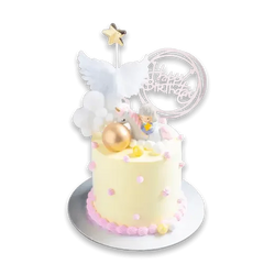 Birthday cake with unicorn topper, pink accents, and 'Happy Birthday' sign for same-day delivery