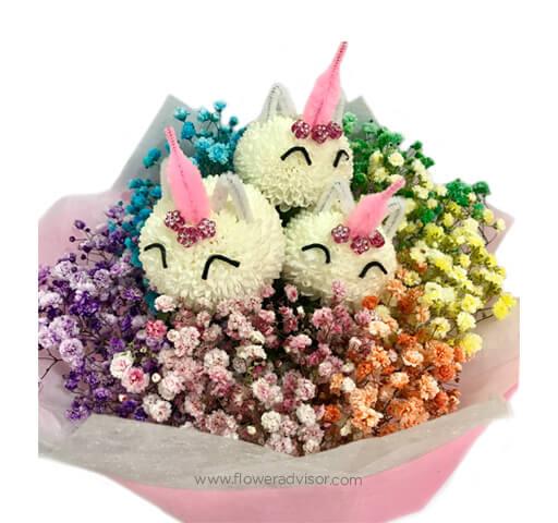 Unicorn themed flower bouquet with colorful baby's breath, available for flower delivery