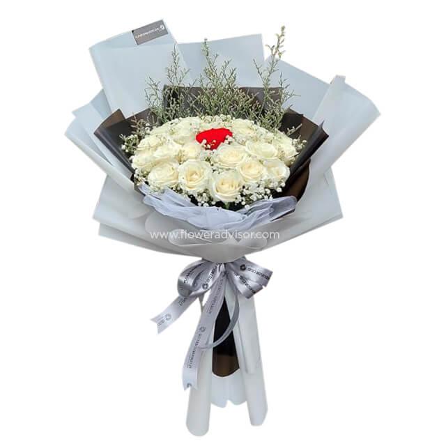 Elegant white rose bouquet with a single red rose, ready for flower delivery in Singapore.