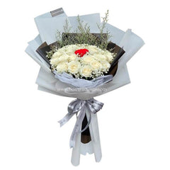 Elegant white rose bouquet with a single red rose, ready for flower delivery in Singapore.