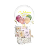 Newborn baby gift hamper with pastel balloons and greeting card, perfect for flower delivery