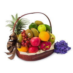 Deluxe fruit basket with fresh mixed fruits and purple flowers for delivery in Singapore