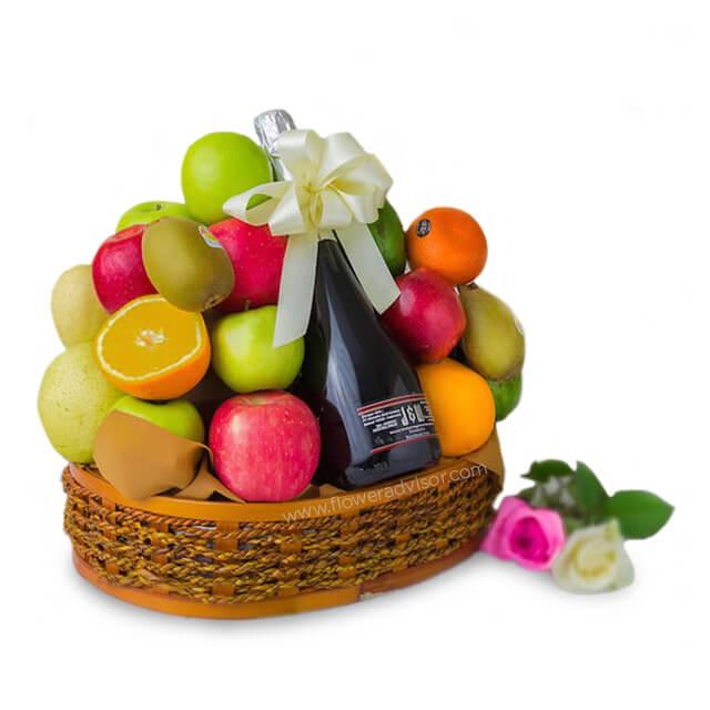 Fresh fruit basket with sparkling juice and roses, ideal for flower delivery gifts
