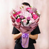 Pink and purple flower bouquet with roses and hydrangeas for flower delivery