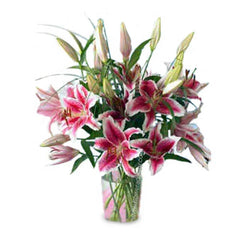 Pink stargazer lilies in a glass vase for Singapore flower delivery