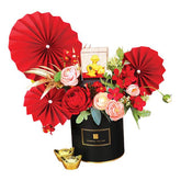 Chinese New Year flower arrangement with red peonies, gold ingots and festive paper fans for delivery