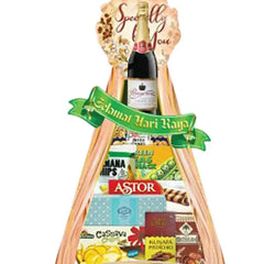 Festive gift hamper with snacks, juice and floral touches, ideal for flower delivery in Singapore.