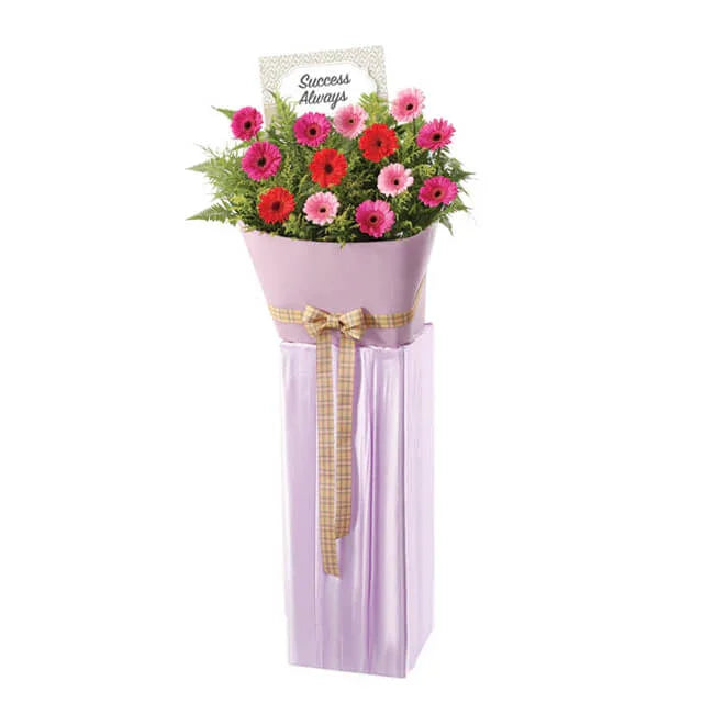 Congratulatory flower stand with pink and red gerberas for flower delivery Singapore