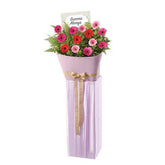 Congratulatory flower stand with pink and red gerberas for flower delivery Singapore