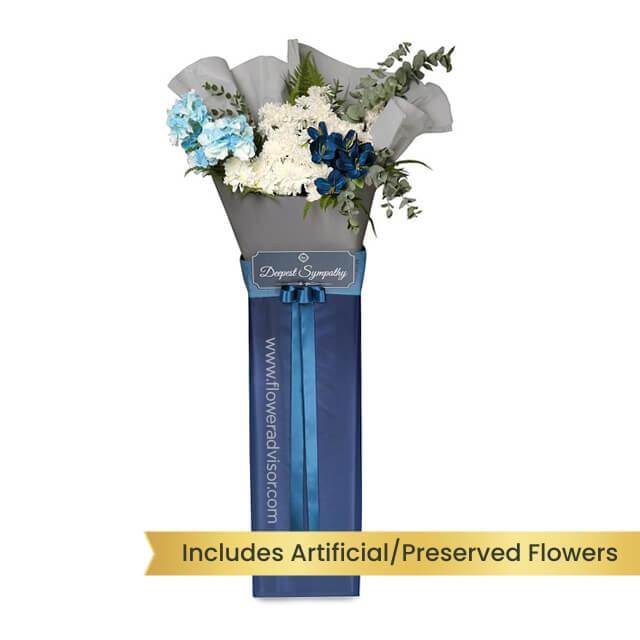 Sympathy flower bouquet with blue and white blooms for flower delivery in Singapore
