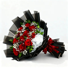 Elegant bouquet of red roses and baby's breath with black wrapping for flower delivery