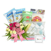 Baby hamper with flower bouquet, baby care products and diapers for flower delivery