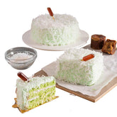 Elegant pandan sponge cake with coconut flakes, perfect for flower delivery gift cakes