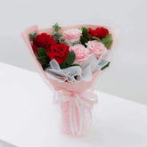 Elegant bouquet of red and pink roses for flower delivery in Singapore