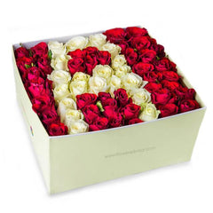 Box of red and white roses arranged for flower delivery in Singapore