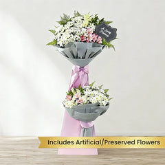 Standing flower arrangement with white and pink preserved flowers for delivery