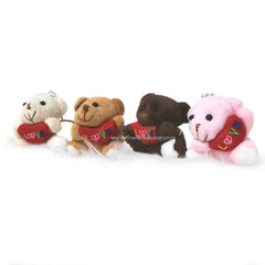 Small teddy bears with heart-shaped love pillows, perfect for flower delivery gifts