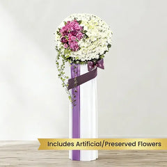 Standing flower arrangement with white and purple blooms, ideal for flower delivery service