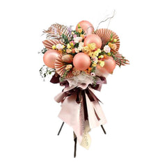 Elegant flower arrangement for delivery with roses, eustoma, and metallic balloons.