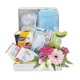 Baby gift hamper with pink flowers, diapers, baby wipes, plush toy and essentials for flower delivery