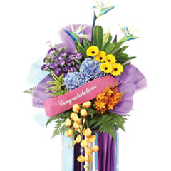 Colorful congratulations flower stand with mixed blooms for Singapore flower delivery