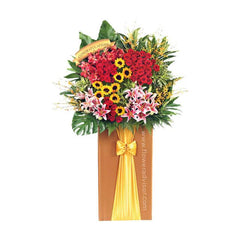 Grand congratulatory flower stand with roses, lilies, sunflowers and greenery for delivery