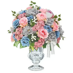 Elegant artificial flower arrangement for delivery with pink, blue, and grey blooms in a glass vase