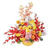Festive artificial flower arrangement with red, yellow, and pink blooms for flower delivery