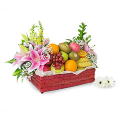 Fruit and flower delivery basket with lilies, roses, grapes, oranges, bananas, and kiwis