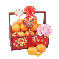 Chinese New Year hamper with fresh oranges, pink peony flower, and festive floral basket for delivery