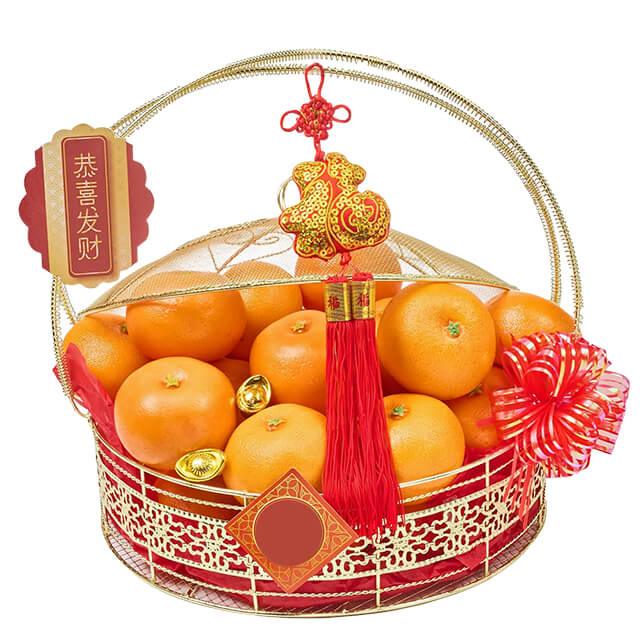 Festive Chinese New Year hamper with fresh oranges, gold ingots, and floral delivery decor