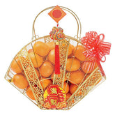 Chinese New Year hamper with oranges, gold basket, red bow for festive flower delivery