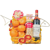 Chinese New Year hamper with oranges, wine, pistachios, flowers, festive decor for flower delivery