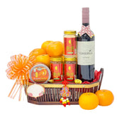 Chinese New Year hamper with oranges, flowers, wine, and festive decorations for delivery