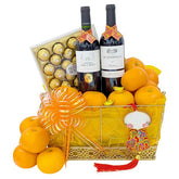 Chinese New Year hamper with oranges, wine, chocolates and festive ribbon, ideal for floral gift delivery
