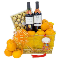 Chinese New Year hamper with oranges, wine, chocolates and festive ribbon, ideal for floral gift delivery