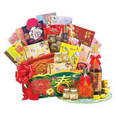 Chinese New Year flower and gift hamper with festive treats, vibrant flowers, and red ribbons
