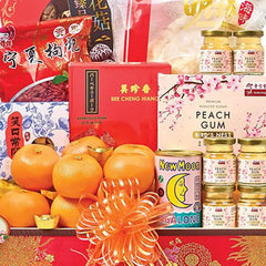 Chinese New Year hamper with oranges, festive foods, and treats for flower gift delivery
