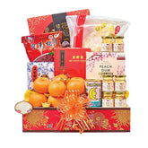 Chinese New Year gift hamper with fresh oranges, festive snacks, and flower-themed ribbon, ideal for flower and hamper delivery.